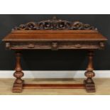 An oak side table or serving table, rectangular top with acanthus carved half-gallery centred by a