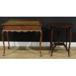 A mahogany writing desk, hipped rectangular top with shallow half gallery and inset writing
