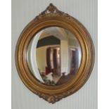 An early 20th century gilt circular mirror, pierced scroll cresting, 45cm diam **This lot is located