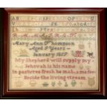 A Victorian needlework sampler, embroidered by Mary Ann Thompson, aged 9, January 1857, with