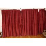 Three curtains, embroidered in gold with fleur de lys on a red ground, 208cm drop, 450cm wide **This