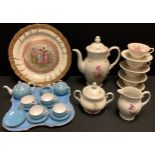A continental cabaret set, comprising small teapot, cream jug, sugar pot and four cups and