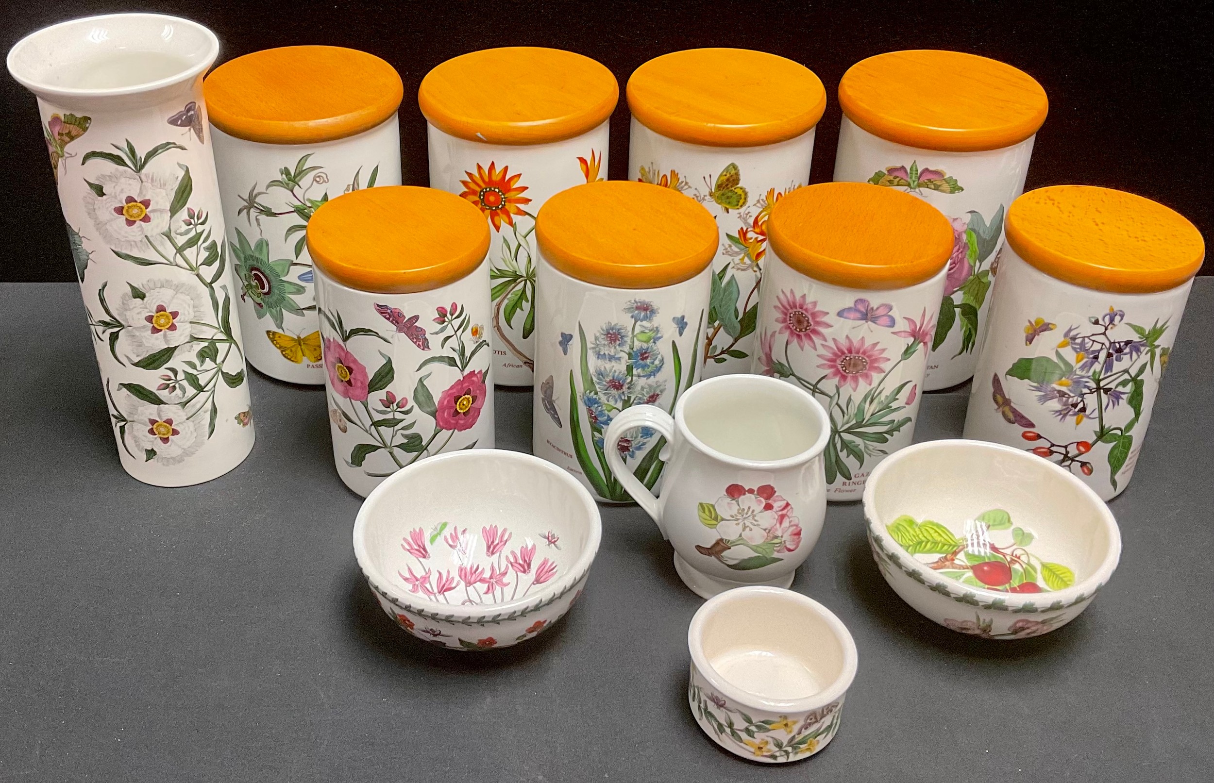A set of four Portemerion Botanical Garden storage jars; others; a Portmerion vase; bowls; etc