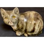 A Winstanley model of a resting cat, glass eyes, size 5, 27cm wide