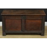 An oak blanket chest, hinged cover above a stylised nulled frieze, 54.5cm high, 106cm wide, 47.5cm
