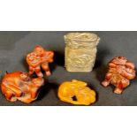 A Japanese boxwood netsuke, as a rat and melon; three others, erotica; a dragon tin (5)