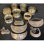 A silver napkin rings, Birmingham 1939; others, various; decanter labels, Brandy, Maderia, Rum;
