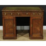 A Victorian twin pedestal writing desk, rectangular top with chamfered foreangles above three frieze