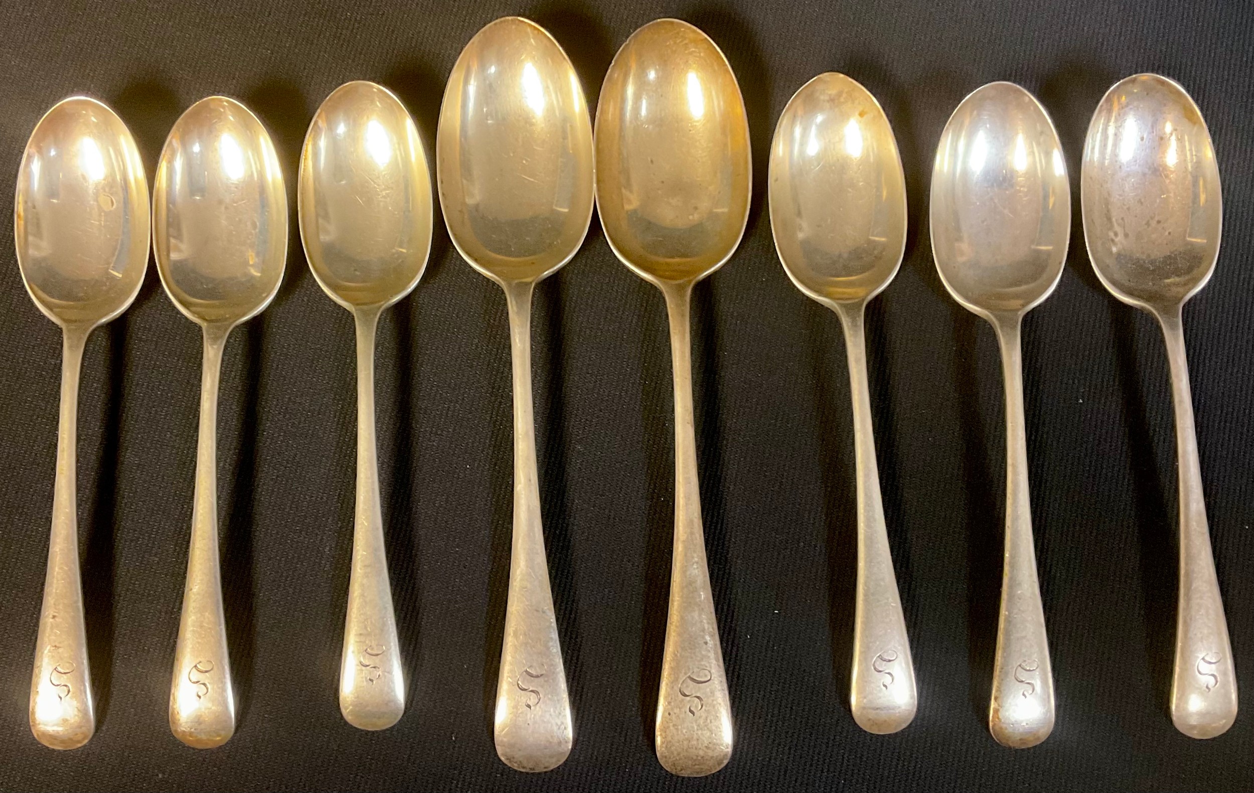 A set of six silver dessert spoons, Sheffield 1960; a pair of silver serving spoons, Sheffield 1960,