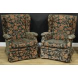 A pair of Parker Knoll wingback armchairs, Model No P.K. 711, 96cm high, 77cm wide, the seat 48cm