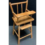 Toys and Juvenalia - an early 20th century doll's wooden high chair, 41cm high