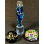 A Murano glass figure sculpture, signed; a Caithness paperweight; another