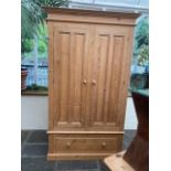A modern pine wardrobe, double doors, drawer to base **This lot is located at Cressbrook Hall,