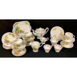 A Shelley Old Mill pattern part tea service comprising cake plates, cream jug, side plates, cups and