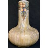 A Cranston pottery tube lined Tukan bottle vase, glazed in mottled shades of ochre and moss green,