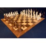 A reconstituted stone chess set, The Lewis Chess Set, after the antique; another, World Famous