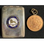 A British Empire Exhibition 1924 matchbook case; a Festival of Britain 1951 medallion (2)