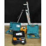 Tools - a Laserliner levelling instrument; a Bostitch nailer; a Makita auto feed screwdriver;