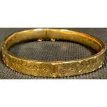 A 9ct gold hollow hinged bangle, 10.6g