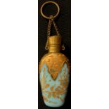 A late 19th century opaque blue glass salts or scent bottle, applied with leafy foliate scrolls in