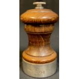 An Elizabeth II silver mounted turned oak pepper grinder, London 1976