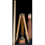 A surveyor's "dumpy" level, tripod and staff, with a bag of ranging poles