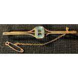 A 9ct rose gold aquamarine bar brooch, safety chain, 6cm, 3.59g, boxed