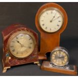 An Art Deco eight-day clock; a lacquer cased mantel clock; an Arts and Crafts mantel clock (3)