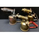 A brass Monitor paraffin blow lamp; two other similar blow torches (3)