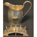 A George V silver helmet shaped cream jug, Nathan & Hayes, Chester 1914; an Oriental silver