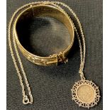 A 9ct gold plated/rolled gold hinged bangle; a George V silver thre'penny bit 1917, mounted in