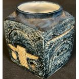 A Troika cube shaped marmalade pot, glazed in shades of blue, 9cm high