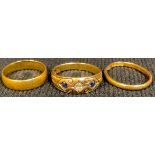 A A 22ct gold wedding band ring, size L, 3g; another 22ct gold ring, size J, 1.6g; an 18ct gold