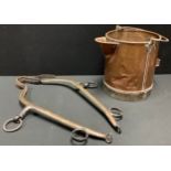 A copper brass mounted bucket, lip spout, swing handle, 36cm high, 46cm wide overall; horse ames (3)