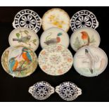 A Royal Crown Derby shaped circular cabinet plates printed and painted with daffodils, 22cm, year