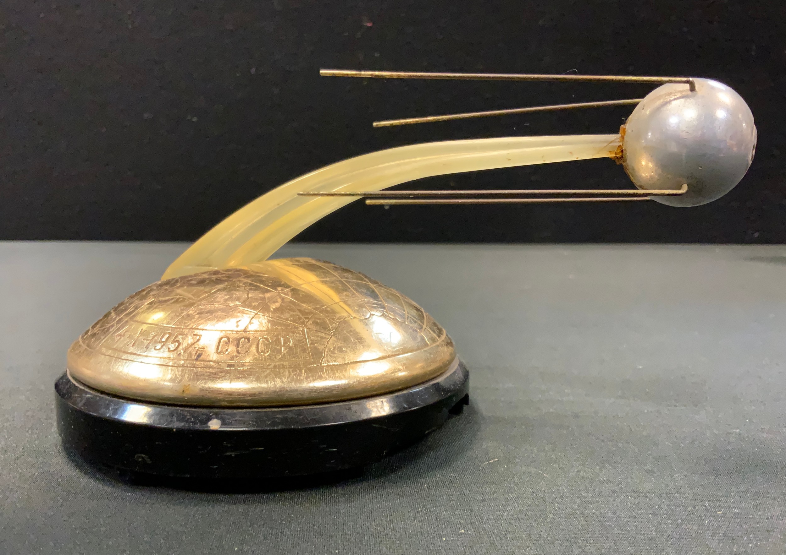 A novelty Russian clockwork musical model commemorating the Launch of Sputnik 1957