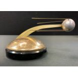 A novelty Russian clockwork musical model commemorating the Launch of Sputnik 1957