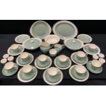 A Wedgwood olive green dinner service, printed marks