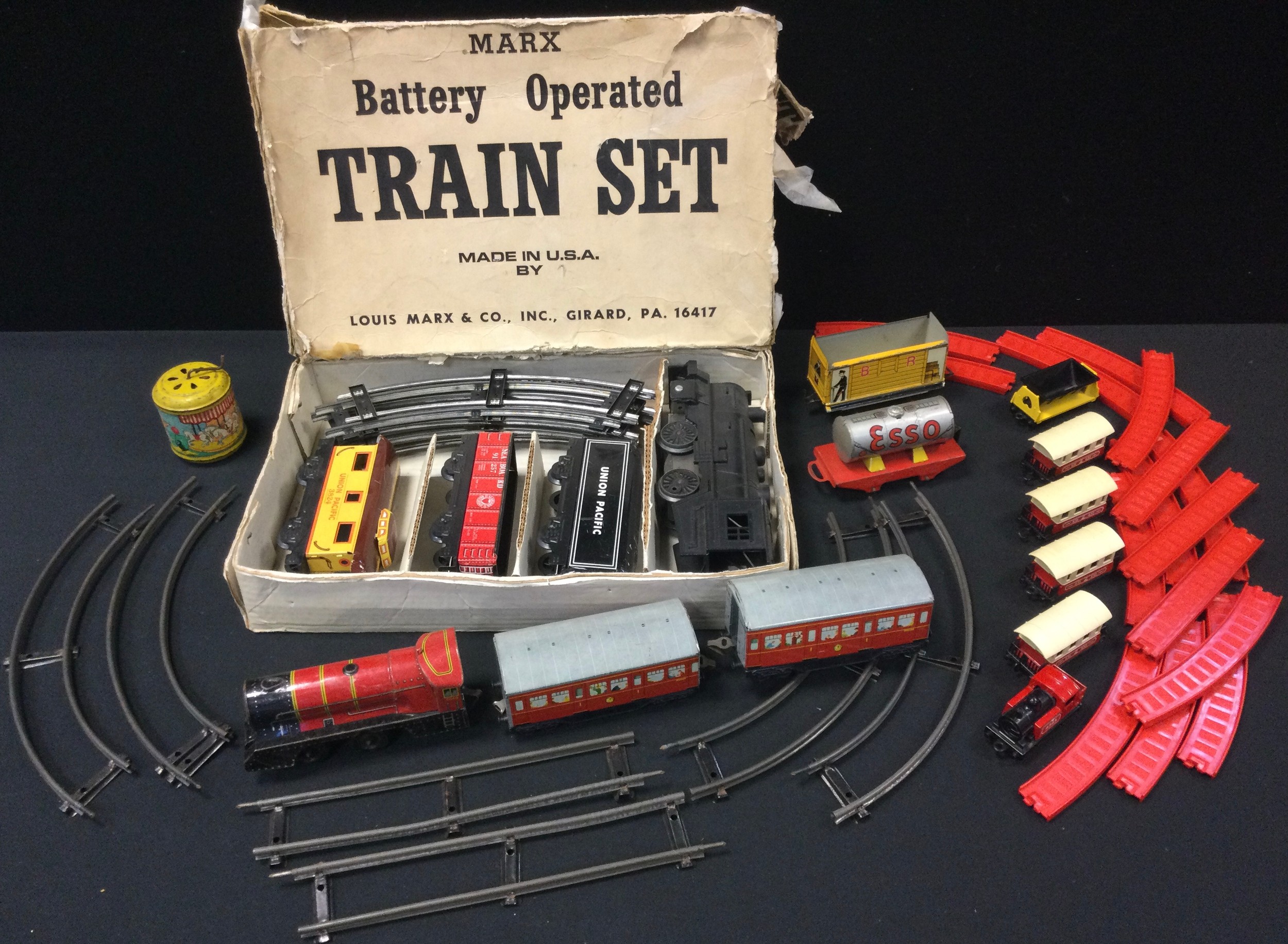 A Louis Marx and Company train set, boxed; a tin plate train set; etc