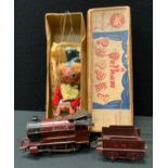 A Hornby O gauge clockwork 0-4-0 locomotive and four wheel tender, maroon and black livery, Rn 5600;