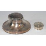 A silver capstan inkwell, 8.5cm diam, Birmingham 1911; a silver pill box, 3.5cm wide, inscribed