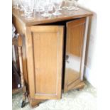 An early 20th century mahogany side cabinet, fielded panelled door, ogee feet, 82cm high, 60cm wide;