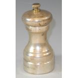 A silver pepper grinder of traditional slender waisted cylindrical form, 10cm high