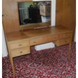 A mid 20th century teak dressing table