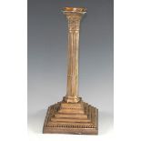 A silver George III style Neo-Classical table candle stick, canted incurved square beaded nozzle,