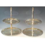 A pair of Elkington & Co EPNS cake stands, the graduated circular tiers with cylindrical column