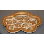 A Japanese shaped oval dressing table tray, well decorated with shaped reserves with warriors,