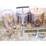 A chrome plated ice bucket and cover; another; an ice bucket; tongs; etc