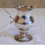 A silver George III pedestal cream jug, stepped base, beaded borders, 12cm high, London 1819, 101.5g