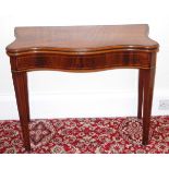 An early George III mahogany serpentine fronted tea table, crossbanded and inlaid with boxwood